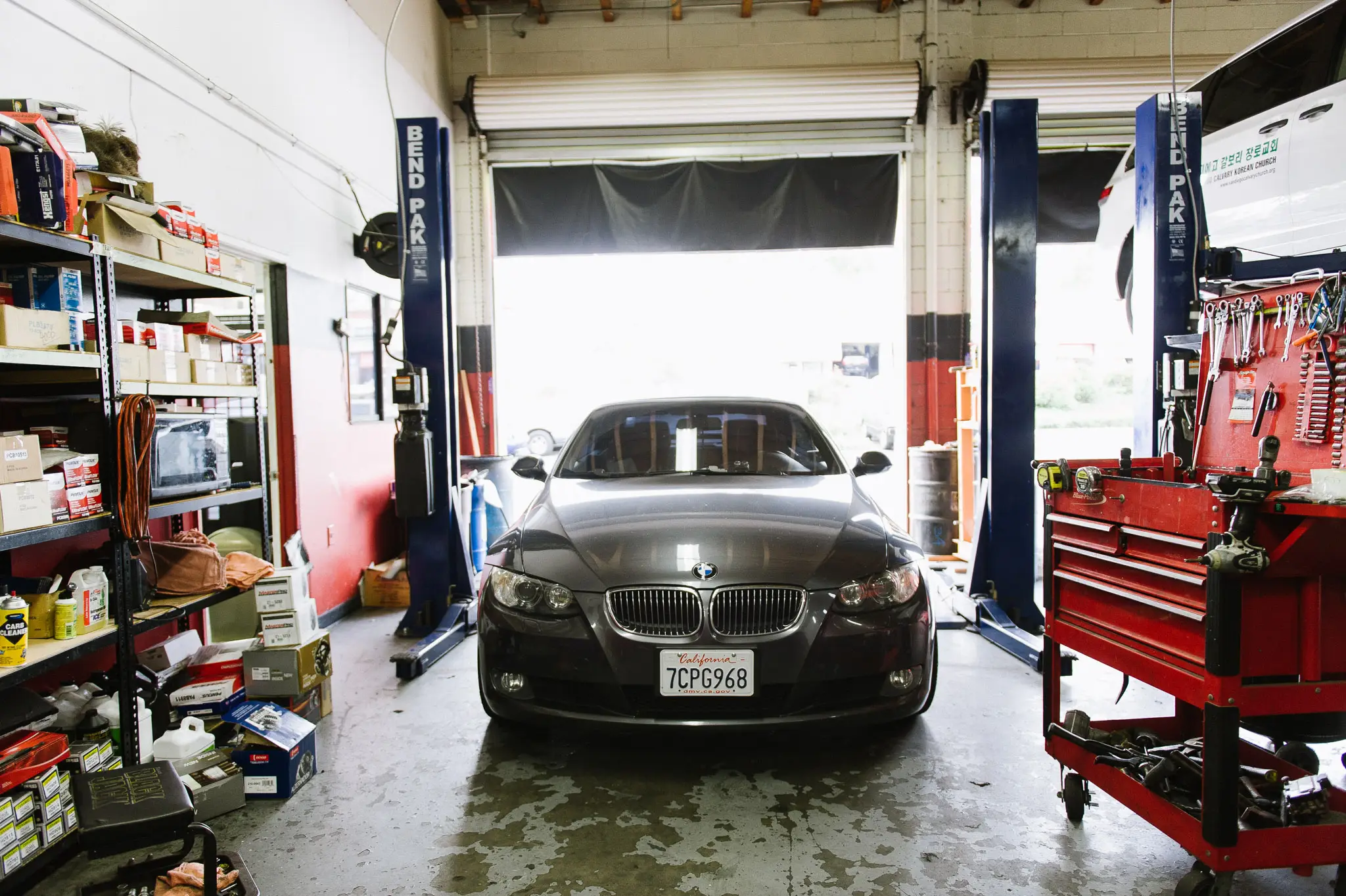 BMW on Bend Pak hydraulic lift in SD Auto Medic service bay